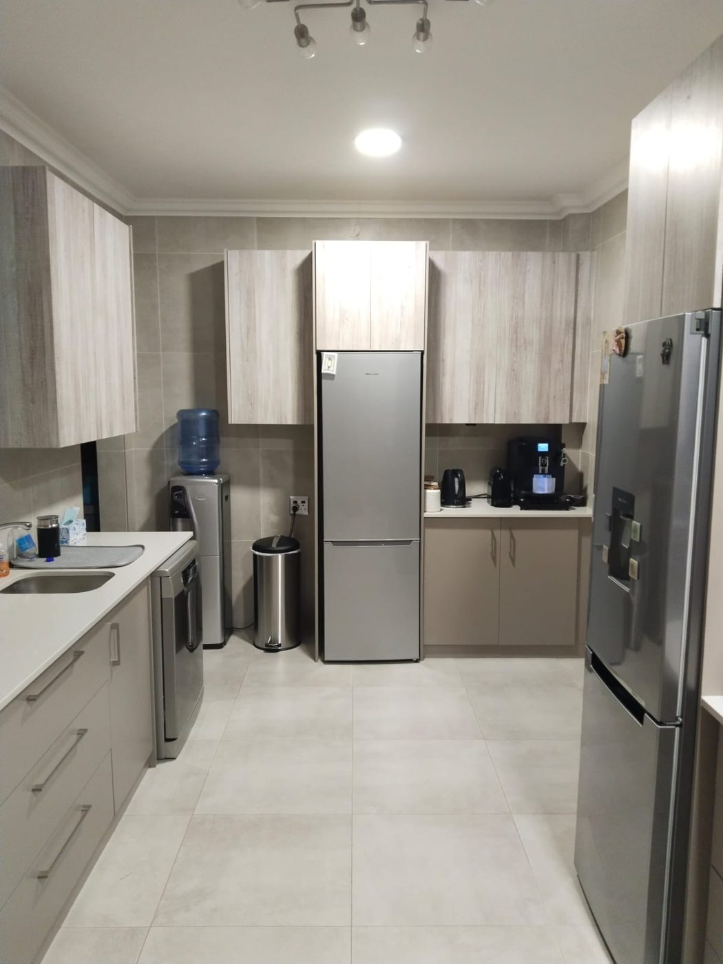 The same fitted kitchen from the prep and fridge side, Centurion